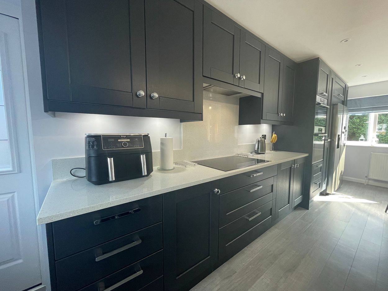 Shaker and handless kitchen design where simplicity is key.