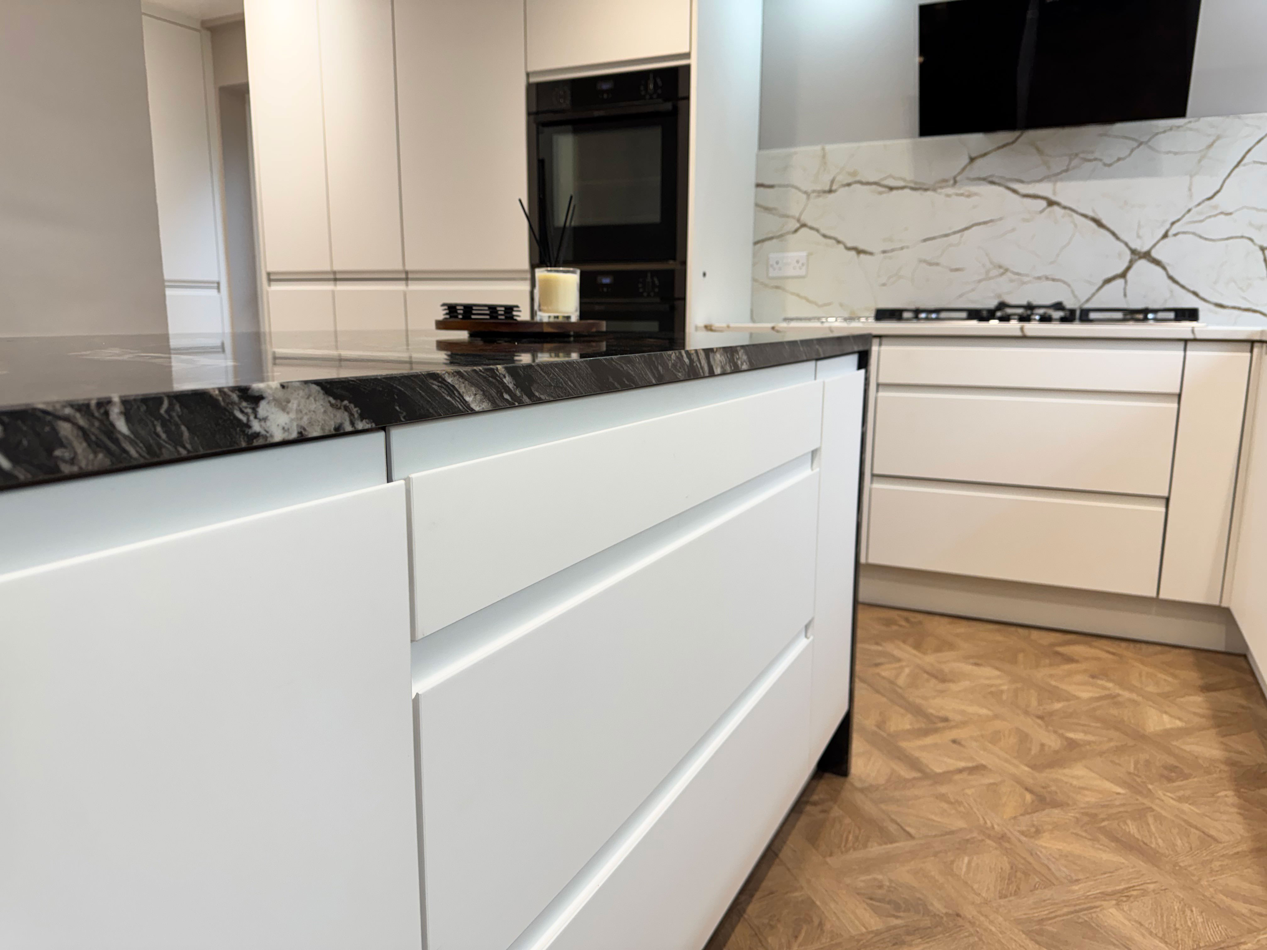 Handless kitchen cupboards in a newly furbished designed Kitchen in Frimley, Surrey.